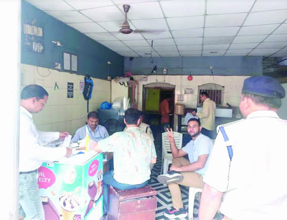 Food safety officer inspects food items