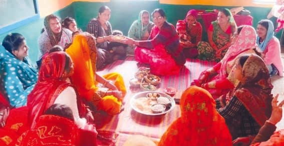 Flying kites and distributing sesame laddus